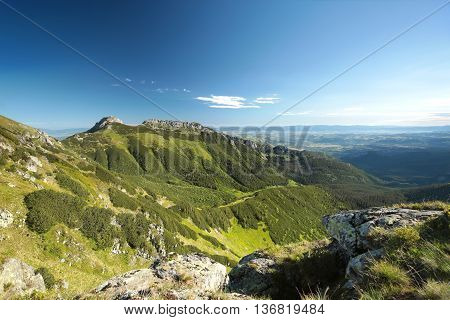Panorama of Tatra Mountains Carpathians sun sunset clouds Nature background Nature landscape Nature background Natural environment Nature background Travel Tourism Adventure Nature Mount Nature background sunrise. Nature background Summit Peak mountains.