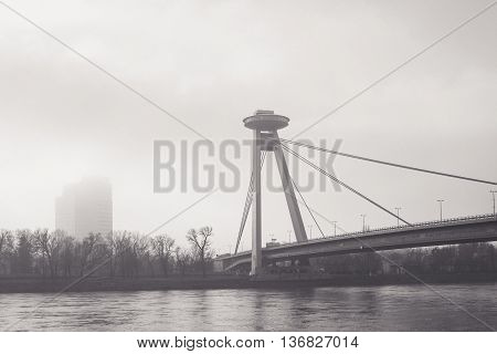 Black and White Landscape with Morning fog above Danube river and New Bridge in Bratislava Slovak Republic