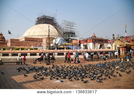 KATHMANDU NEPAL - APRIL 18 2016 : Boudhanath stupa under reconstruction after the earthquake on 25 April 2015 Boudhanath is one of famous place in Nepal and the largest ancient stupa in the world.