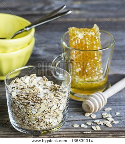 Ingredients for breakfast cereals, milk honeycomb on a dark wooden background