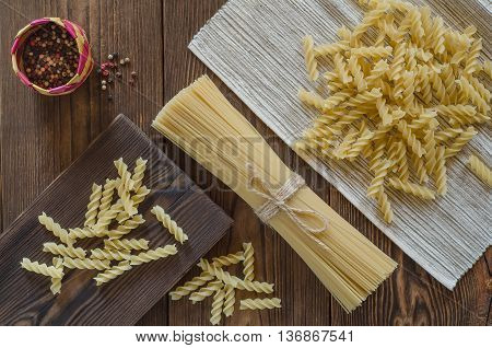 Spaghetti pasta with pepper on a wood table top