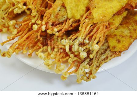 needle mushroom fried dumpling wrapper on dish