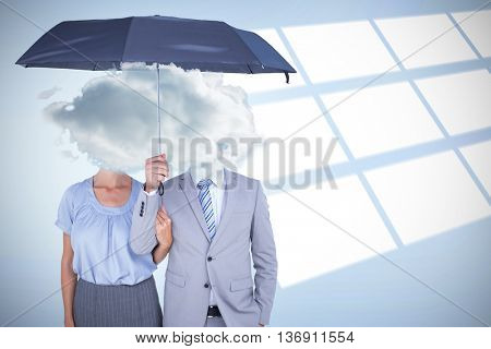 Business people holding a black umbrella against digital image of pattern