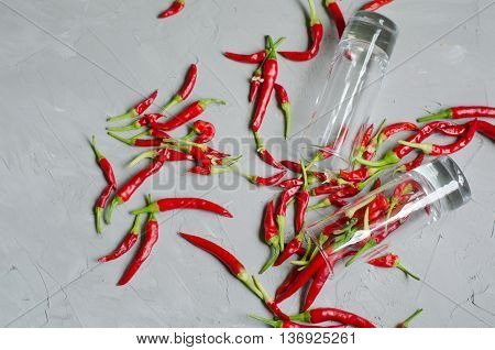 Shots with vodka and chilly peppers hot alcoholic drink