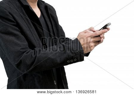 Businessman wearing a black suit typing on smartphone screen