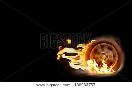 Car racing spinning wheel burns rubber on fire.