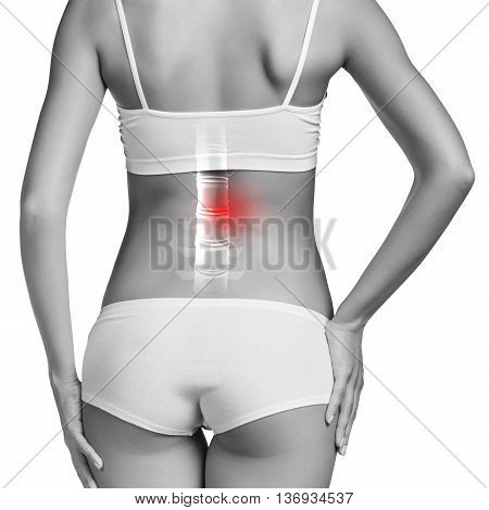 Digital composite of highlighted spine of woman with back pain