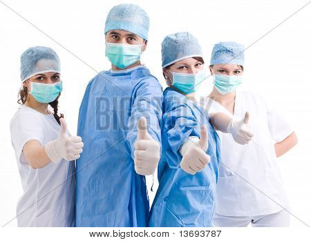 Team von Chirurgen showing Thumbs up