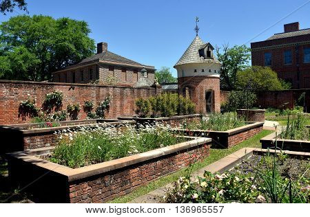 New Bern North Carolina - April 24 2016: Raised brick planting beds with dovecote in the gardens at 1770 Tryon Palace