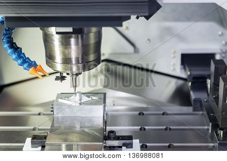 CNC Milling operation on the sample work pieces the CNC milling machine while cutting the sample work piece