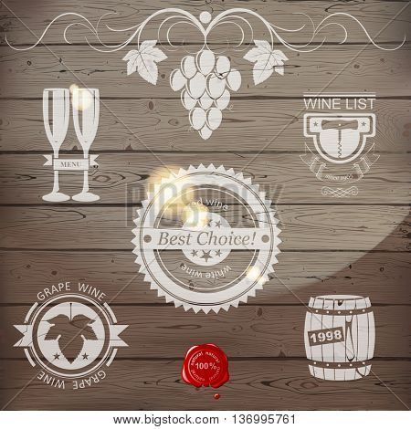 Stylized wine emblems on wooden background