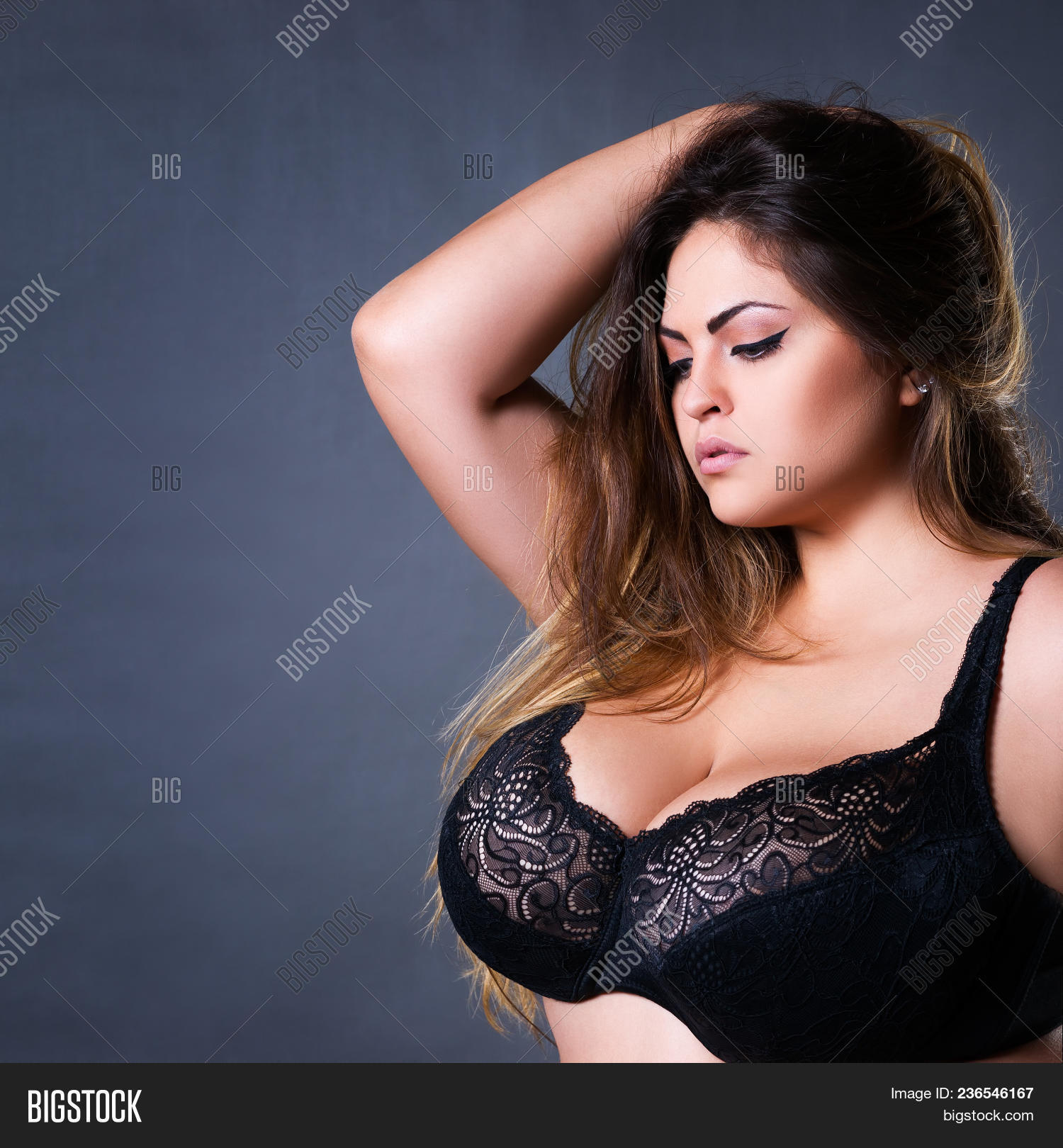 Foto de Sexy busty lingerie model do Stock