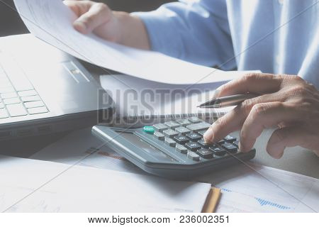 Men Are Saint Documents About Accounting With Calculator Notbook On Desk.