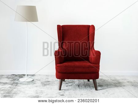 Wing back chair on a carpet no people