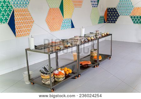 Metallic Movable Tables With Fruits, Vegetables And Kitchen Utensiles Prepared For A Cooking Competi