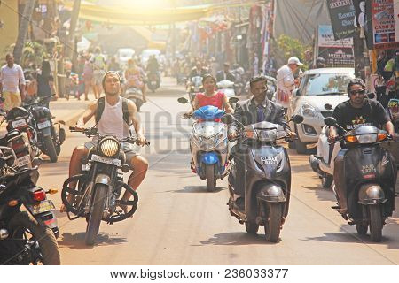 India, Goa, Arambol. January 28, 2018. The Central Street Of Arambol, On Which People Go On Scooters