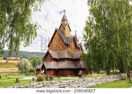 Heddal, Norway-august 15, 2014 -  Old Stave Church And Cemetery In Norwegian Village.