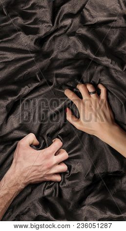 Couple's Hand Holding A Satin Sheet, A Moment Of Pleasure
