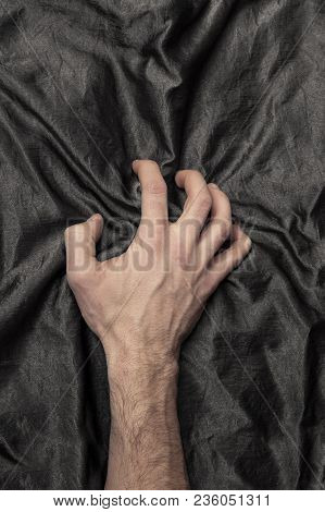 Man's Hand Holding A Satin Sheet, A Moment Of Pleasure
