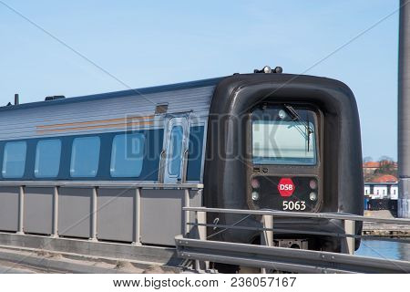 Vordingborg Denmark - April 6. 2018: A Dsb Ic3 Train Passing The Masnedsund Bridge In Denmark
