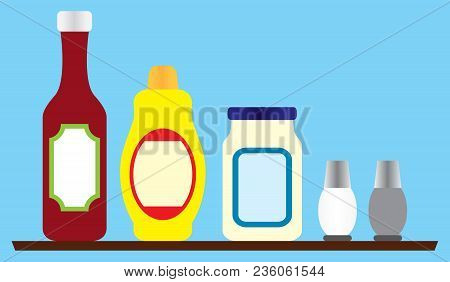Several Condiments Resting On A Wooden Shelf Ready For Use