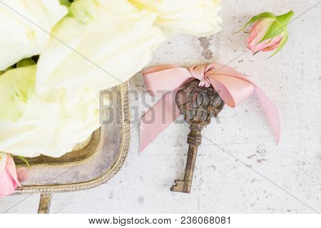 Pink And White Blooming Roses With Sceleton Key