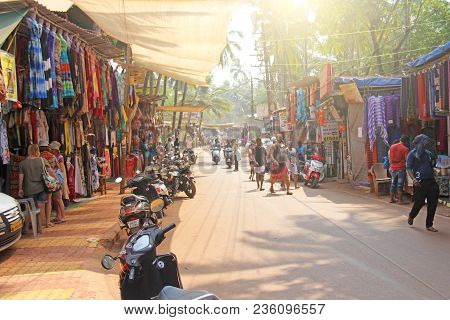India, Goa, Arambol. January 28, 2018. The Central Street Of Arambol, On Which People Go On Scooters