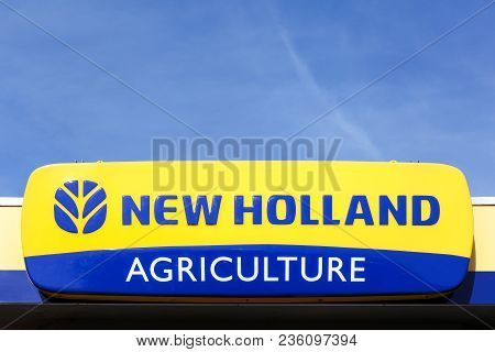 Norremarken, Denmark - March 25, 2017: New Holland Agriculture Logo On A Facade. New Holland Is A Br