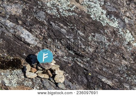Cryptocurrency Mining Auroracoin In A Rock Background Composition