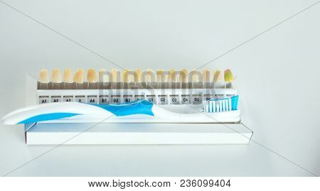 Dental Model And Dental Equipment On Blue Background, Concept Image Of Dental Background. Dental Hyg