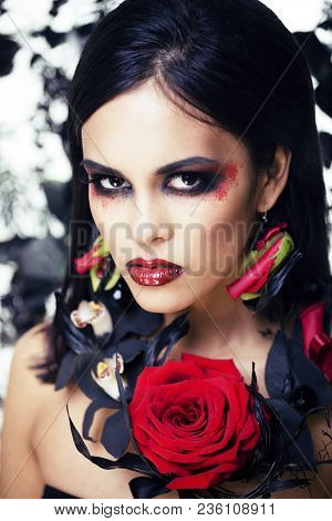 Pretty Brunette Woman With Rose Jewelry, Black And Red, Bright Make Up Kike A Vampire Closeup Red Li