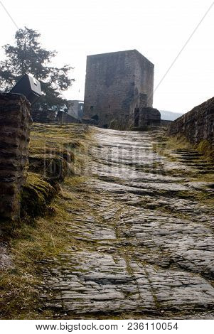 Grass Covered Path Up To Castle