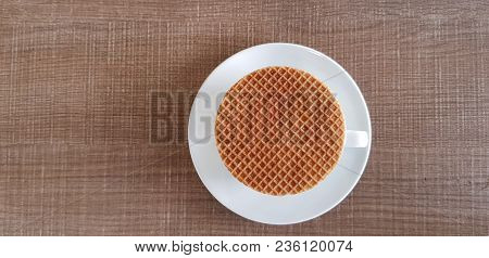 Stroopwafel A Famous Waffle From Dutch On The Black Coffee Cup