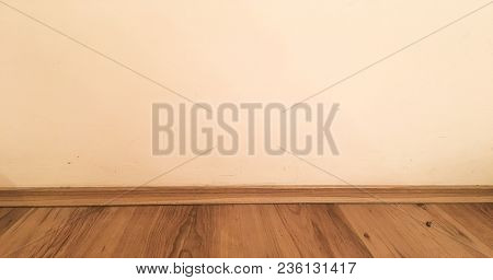 Room Wood Floor Perspective, Grunge Pastel Painted Concrete Wall And Varnished Wooden Laminate Plank