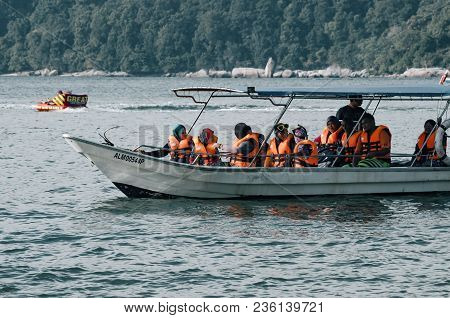 Pangkor Island, Malaysia - 17 December 2017 : Tourist Enjoying Beach Activities And Return From Isla