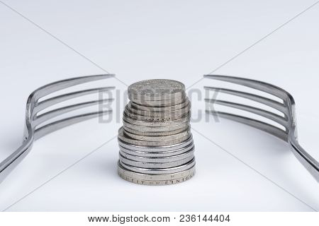 Conceptual Representation Of Financial Greed By Two Forks And Coins