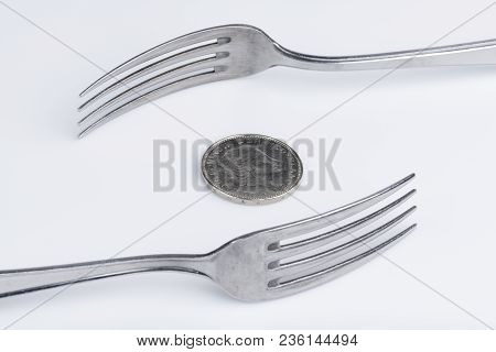 Conceptual Representation Of Financial Greed By Two Forks And Coins