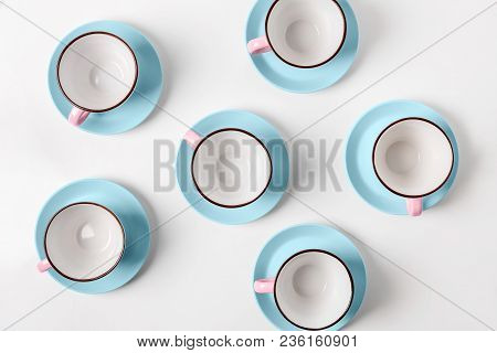 Clean Coffee Or Tea Set. Plenty Of Elegant Porcelain Light Blue Saucers And Pastel Pink Cups And At 