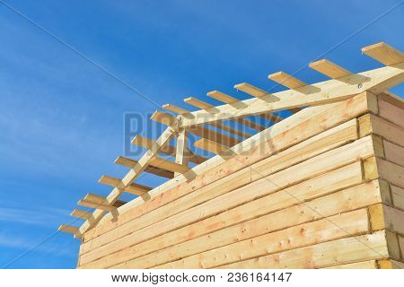 Details Of Construction Wooden House On Bule Sky Background, Roofing Timber Structure System