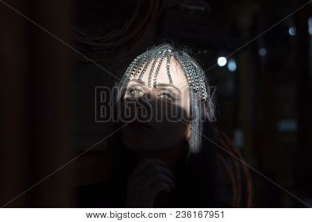 Portrait Of A Young Beautiful Woman In Arabic Style With A Decoration On Her Head.