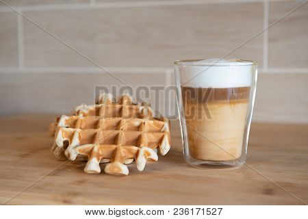 Glass Cups Of Multilayer Coffee With Mini Stroopwafel, Syrupwaffles Cookies On Light Gray Background