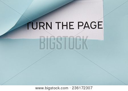 Turn The Page Text Appearing Behind Torn Blue Paper, Top View. New Lofe And Opportunities Concept, C