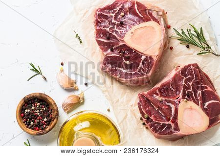 Raw Beef Steak Osso Bucco And Ingredients For Cooking. Marble Meat. Top View With Copy Space On Whit