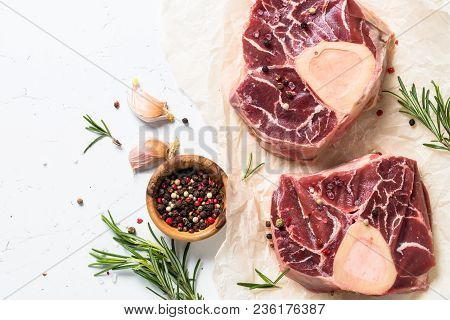 Raw Beef Steak Osso Bucco And Ingredients For Cooking. Marble Meat. Top View With Copy Space On Whit