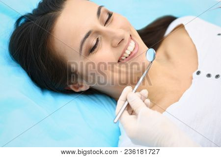 Young Female Patient Visiting Dentist Office.beautiful Woman With Healthy Straight White Teeth Sitti