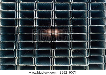 Construction Steel Profile Pipe Of Rectangular Shape With Corrugated Surface In Warehouse.