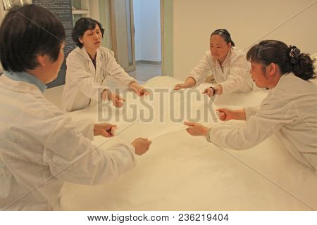 China, Suzhou-april 16, 2012. Silk Factory In China. Women Make Silk Blankets.