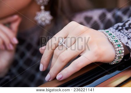 Beautiful Woman With Yellow Sport Car. Young Female Model With Lixury Diamonds Jewerly Sitting In A 