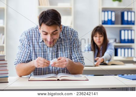 Students sitting and studying in classroom college
