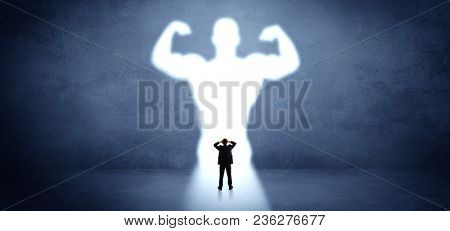 Businessman standing and dreaming about a strong superhero